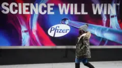 A billboard outside the Pfizer HQ in New York