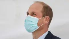 Prince William wearing a mask