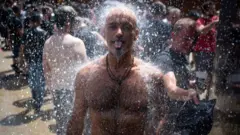 Image shows man cooling off