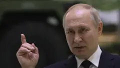 путін