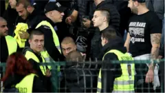 Stewards appeared to join those chanting racist abuse