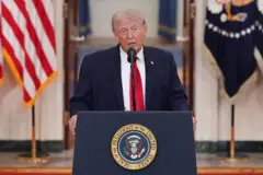 U.S. President Donald Trump tok from di Cross Hall of di White House on April 1, 2026 in Washington, DC. Trump use di prime-time address to update di nation on di war for Iran.