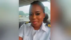 Tracy Olushola Atobatele inside a car