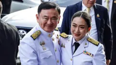 Pheu Thai Party Leader Paetongtarn Shinawatra Receives Appointment To Become Thailand's Prime Minister.
Thailand's newly elected Prime Minister Paetongtarn Shinawatra (R) is meeting her father, former premier Thaksin Shinawatra (L), upon her arrival to receive the royal command appointment to become prime minister, at the Pheu Thai Party's headquarters in Bangkok, Thailand, on August 18, 2024. (Photo by Anusak Laowilas/NurPhoto via Getty Images)