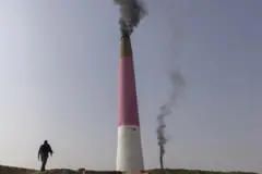 Smokestacks emit fumes from brick factories in Deh Sabz District, Kabul Province, Afghanistan, on Tuesday, Nov. 1, 2022. Afghanistan's economy has been in free fall since Taliban takeover of power August last year after an abrupt cut in international aid, which accounted for 40% of its gross domestic product and 75% of total government spending, and the UN says more than half the country's population or 20 million are facing acute hunger. Photographer: Victor J. Blue/Bloomberg via Getty Images
