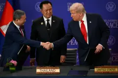 Thailand's Prime Minister Anutin Charnvirakul watches as Cambodia's Prime Minister Hun Manet and U.S. President Donald Trump shake hands on the sidelines of the 47th Association of Southeast Asian Nations (ASEAN) Summit in Kuala Lumpur, Malaysia, October 26, 2025. Mohd Rasfan/Pool via REUTERS