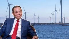 Ảnh thiết kế: Ông Phạm Nhật Vượng mặc áo vest xanh dương, sơ mi trắng, thắt cà vạt đỏ trên nền nhà máy điện gió ở Việt Nam 