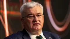 Андрей Сибига в темном помещении 17 апреля 2026 г