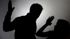 silhouette of man beating a woman 
