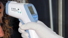 A health official in Ethiopia checking temperature in Addis Ababa - acrhive shot, 2015