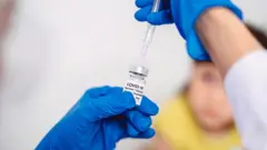 Covid vaccine being administered