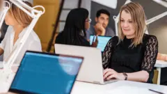 Workers at hot desks