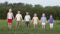 Boys and girls in height order