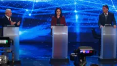 Lula, Simone Tebet e Bolsonaro durante debate na Band
