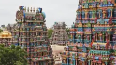 மதுரை மீனாட்சி அம்மன் கோயிலின் நான்கு கோபுரங்கள். (கோப்புப்படம்)