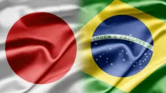 Bandeiras japonesa e brasileira se fundindo