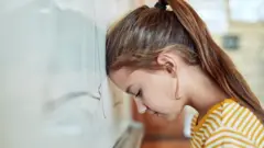 A young girl in a classroom