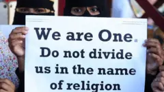 People from different human rights organizations hold placards during a protest against BJP-lead government and Chief Minister of Uttar Pradesh Yogi Adithyanath over the so-called "love Jihad" law,