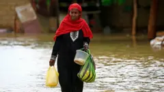 women in sudan floods