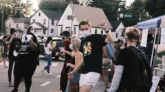 people waring mask and dancing