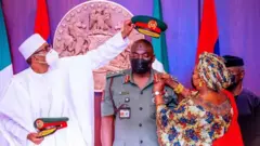 File photo of President Buhari dey decorate di late Chief of Army staff Lt Gen Ibrahim Attahiru