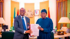 President Bola Ahmed Tinubu receive di report on di investigation of Presidential Foreign Investment Promotion Council Director-General, Adeniyi Adeyemi, from di ICPC Chairman Dr. Musa Adamu Aliyu, SAN, inside di State House, Abuja, on Thursday, August 6, 2026.