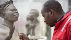 Peter Oloya akiwa kazini mnamo 2019