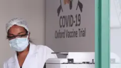 An employee is seen at the Federal University of Sao Paulo (Unifesp) where the trials of the Oxford/AstraZeneca coronavirus vaccine are being conducted