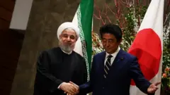 روحانی و آبه