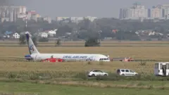 A Ural Airlines A-321 passenger plane is seen oon the site of its emergency landing in a field outside Zhukovsky airport in Ramensky district of Moscow region, Russia.