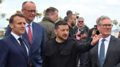 President of France Emmanuel Macron, Chancellor of Germany Friedrich Merz, President of Ukraine Volodymyr Zelenskyi, and Prime Minister of the United Kingdom Keir Starmer are seen after a press conference during meeting of ‘Coalition of the willing’ on May 10, 2025 in Kyiv, Ukraine. 