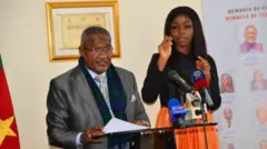 Elecam chairman Dr. Enow Egbe wear one grey suit, during di constitution of di National Commission for di final vote counts