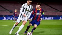 Cristiano Ronaldo (left) and Lionel Messi in action during the group stages of the 2020/21 Uefa Champions League