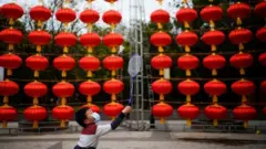Boy plays badminton in Wuhan street - 8 February