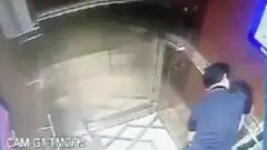 Mr Nguyen Huu Linh hugging a girl in a elevator.