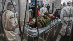 Jmai'an lafiye rufe ruf da rigar kariya daga cutar Coronavirus