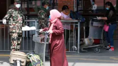 कुवेतबाट फर्किएका महिला