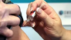 File photo of a person receiving a vaccination