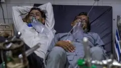 বেডের অভাবের কারণে এক বেডে দুজন রোগীকেও রাখা হচ্ছে।