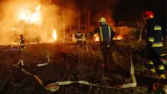 Firefighters work at a site of a power substation hit by a missile strike, as Russia's attack on Ukraine continues, in Lviv, Ukraine May 3, 2022