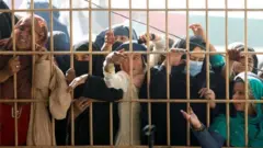 Afghan women queue for visas for Pakistan