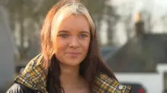 Nicole Peterkin speaking to the camera outside in Aberdeenshire