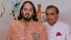 Anant y su padre, Mukesh Ambani