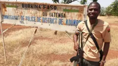 Man poses during army training in Burkina Faso