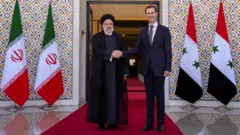 সিরিয়ার প্রেসিডেন্ট বাশার আসাদের সাথে ইরানী প্রেসিডেন্ট ইব্রাহিম রাইসি