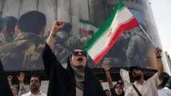 Iranians wave national flags during an anti-US and anti-Israel demonstration in Tehran, Iran, 22 June 2025