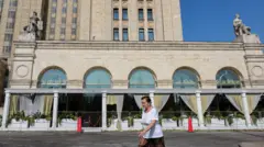 A woman walks in front of the Balzi Rossi restaurant in Moscow.