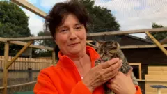 Tina Lewis and a cat