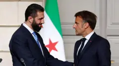 الرئيس الفرنسي ورئيس المرحلة الانتقالية في سوريا