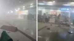 A composite image with two frames showing the inside of Dubai airport filled with smoke, some figures can be seen walking through the smoke and debris on the floor 